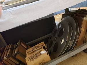 lot 1164 image: MOVIE REELS AND REEL BOXES IN STYLESSIZES SHOWN.