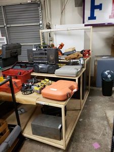 lot 1193 image: LARGE METAL DISPLAY  TABLE AS SHOWN. CONTENTS SHOWN NOT INCLUDED (DELAYED PICK UP BETWEEN 200 PM AND 400 PM)