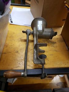 lot 1195 image: VINTAGE MANUAL MEAT GRINDER AS SHOWN.