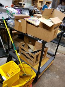 lot 1206 image: METAL FRAME AND WOOD TOP STANDTABLE AS SHOWN. CONTENTS SHOWN NOT INCLUDED (DELAYED PICK UP BETWEEN 200 PM AND 400 PM)