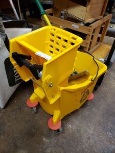 lot 1258 image: MOP BUCKET WITH WRINGER AS SHOWN.