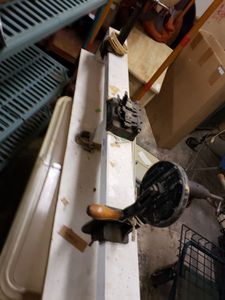 lot 1272 image: VINTAGE GRISWOLD FILM SPLICE, MOUNTED AS SHOWN.