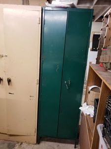 lot 1281 image: SLIM METAL STORAGE CABINET AS SHOWN. CONTENTS NOT INCLUDED (DELAYED PICK UP BETWEEN 200 PM AND 400 PM)