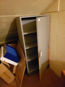 lot 1454 image: WOOD STORAGE SHELF WITH LOCKABLE DOORKEY.