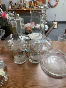 lot 1397 image: ETCHED DESIGN DECANTERS AND GLASSES AS SHOWN.