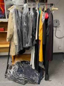 lot 990 image: RACK WITH VARIOUS CLOTHES AS SHOWN.