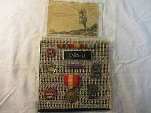 lot 22 image: Lot- U.S. ARMY Uniform Military Insignia  Metals, and Clipping