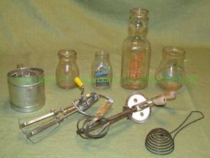 lot 105 image: Vintage glass milk bottles and vintage kitchen utensils