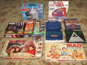 lot 114 image: Assorted board games including Mad, Tri-ominoes, projection tracer and others as shown