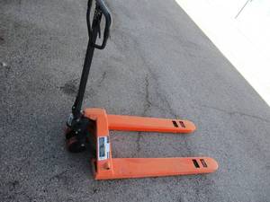 lot 86 image: NEW -  Haul Master- 5000-Lb. Pallet Jack- Stored Outside- Paint Is Slightly oxidized