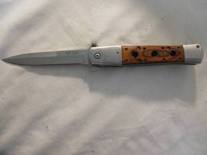 lot 134 image: Wood And Metal-Finger Assist Flip Open, 4- Lock Blade Pocket Knife With Belt Clip.