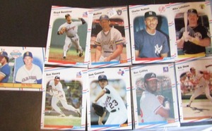 lot 162 image: FLEER 1988- Various teams and players. Cards 169-649. Not consecutive. 9 cards total, 2 in sleeves. Fair condition, slight edge ware and fading.