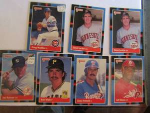 lot 180 image: � 1988 DONRUSS- tagged 1987 leaf. Various players and teams. Cards 482-564. Not consecutive. 7 cards total (2 in sleeve). Average condition, edge ware and fading.