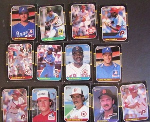 lot 183 image: � DONRUSS 1987- tagged 1986 Leaf. Various players and teams. Cards 288-385. Not consecutive, 13 cards total. Fair condition, faded, staining, bent, worn edges.