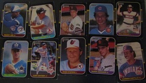 lot 181 image: � DONRUSS 1987- tagged 1986 Leaf. Various players and teams. Cards 517-628. Not consecutive, 10 cards total. Fair condition, faded, staining, bent, worn edges.