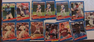 lot 202 image: DONRUSS 1991- various teams and players. Cards BC-5 thru BC-8 and 32-81. Not consecutive. 13 cards total. Average condition, some bend, slight fade and worn edges.