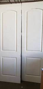 lot 31 image: White Hinged Doors (8x30 Approx., 2 Total)
