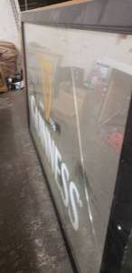lot 164 image: Guiness Mirror 60x36, has crack