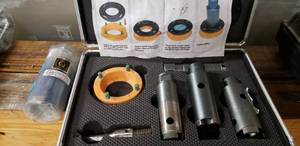 lot 213 image: Gila Tools Granite Diamond stone coring bit set for marble, granite, concrete, and masonry. boring set with extra size slightly used See Website link for details