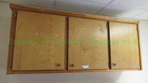 lot 65 image: Wood wall mount cabinet as shown, attached to wall