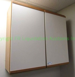 lot 10 image: American Woodmark wall cabinet. Mounted to wall with screws