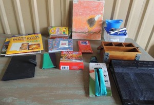 lot 33 image: Collapsible desk top filer, zip pack for pencils, desk top pen and pencil holder, bag of colored pencils and more.