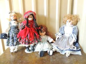 lot 85 image: Porcelain doll lot- 23 Price Production doll in blue & silver dress,   18 tall red head in green and white dress ,   18 Little Red riding hood church dress