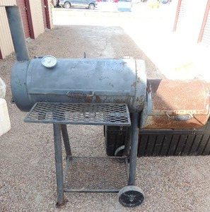 lot 90 image: Metal smoker chuck wagon 47H X61w  ptrowned