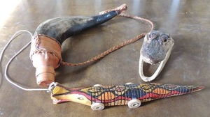 lot 96 image: Baby crock head, powder horn and gator toy fish
