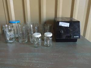 lot 20 image: CD holder with 20  empty CD cases, S&P shakers, 5 tea glasses and mason jar