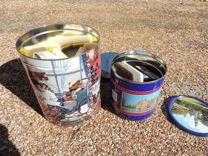 lot 28 image: 2 tins full of shoe shine materials and a lint roller