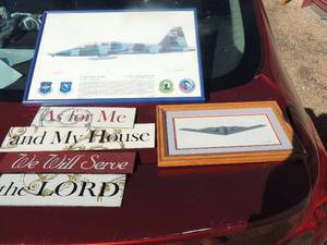 lot 23 image: Columbus Air Force 49th flying training photo signed by Don Feight 17x11, 4 tier metal hanger As for me and my house we will serve the Lord 11x6 and photo of a B-2A spirit