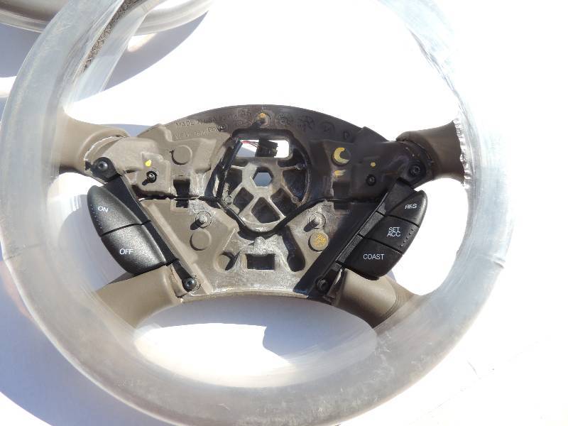 lot 107 image: Steering Wheels Grey with cruise control buttons