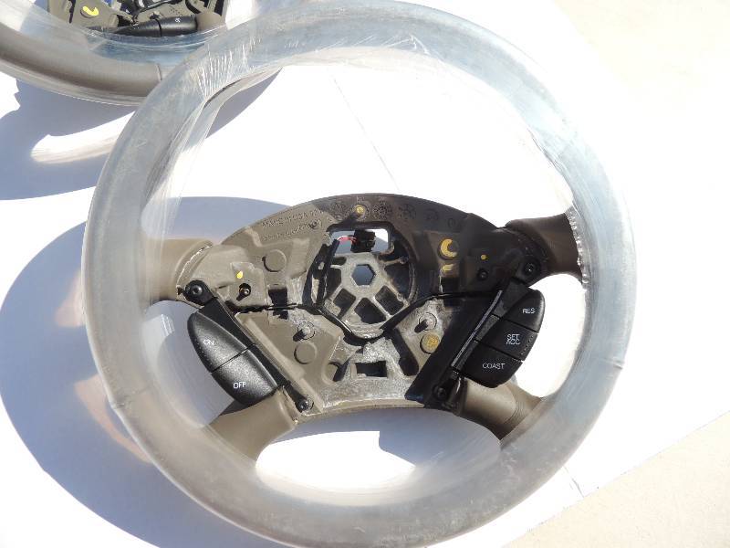 lot 106 image: Steering Wheels Grey with cruise control buttons