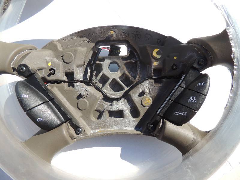 lot 105 image: Steering Wheels Grey with cruise control buttons