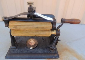 lot 4 image: The Original Knox Fluting Iron double rollers and handle crank   Patent  1866 Reissue 1870