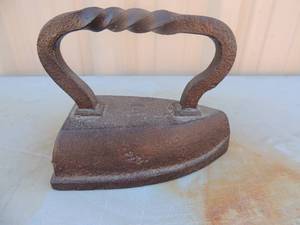 lot 3 image: Solid cast iron with #14 on top. Twisted handle 7x8x5