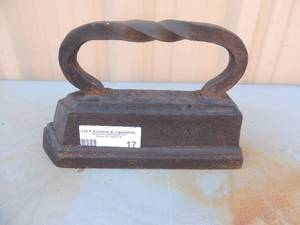 lot 17 image: Cast iron twisted handle marked C-16very heavy 6x10x3