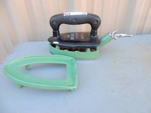 lot 19 image: The Rhythm Iron no. 35 Radiation   color green 7x12x5 with stand