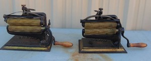 lot 29 image: 2 Grown pat 1121875 FLUTERS CRIMPER IRONS  solid cast iron both have 2 rollers 8x13x6 both  the same times the money