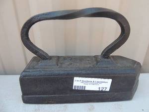 lot 127 image: Cast iron with handle Marked GIW20 99x3x7