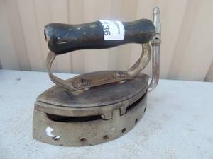 lot 136 image: Cast iron with handle marked double point I want u comfort gas iron Straus Gas iron Co. Philadelphia, PA 7x4x5