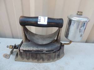 lot 139 image: Cast iron with handle has gas steam chamber marked the moniton pat. April 14 1905 7x3x6