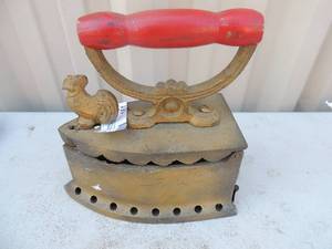 lot 161 image: GOLD COLORED Cast iron with  RED Handle features a Rooster no markings 6x4x7