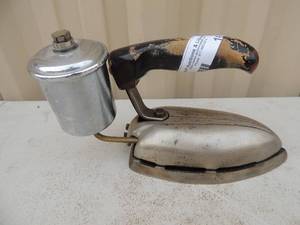 lot 167 image: Metal iron with handle has gassteam canister no markings 7x4x6