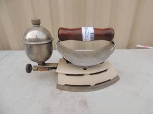 lot 170 image: Metal iron with handle has gas steam canister no markings 7x4x6