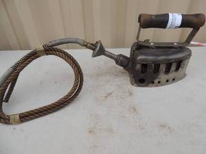 lot 173 image: Metal iron with handle gas hose no readable markings 6x4x6