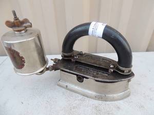 lot 179 image: Cast iron with handle has gassteam canister Marked imperial brass MFG co. chicago IL, model 15 Imperial self heating iron 6x3x6