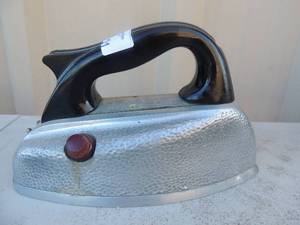 lot 191 image: Cast iron with handle marked mermaid steam iron Hope products Inc. St. Louise Missouri 600 watts 115 volts 9x4x6g