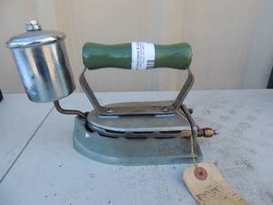 lot 201 image: Cast iron with handle has gassteam canister marked the royal iron the royal self heating iron co. 7x3x6